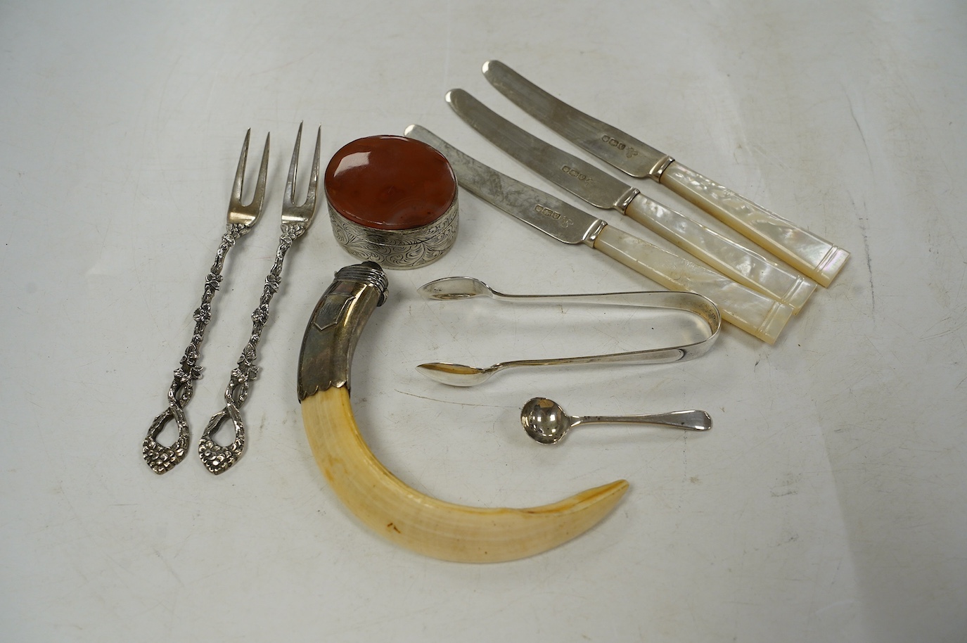 A 19th century white metal mounted tusk vinaigrette? (lacking grille), 11cm and a small quantity of 19th century and later silver cutlery, 10.4oz, including a cased christening trio and a Georg Jensen spoon and a box. Co